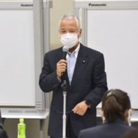Akira Amari, who heads a ruling Liberal Democratic Party group on economic security, talks at a meeting in Tokyo on Thursday. | KYODO