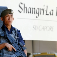 A Gurkha police officer stands guard outside the venue of the IISS Shangri-La Dialogue in Singapore in May 2019. | REUTERS