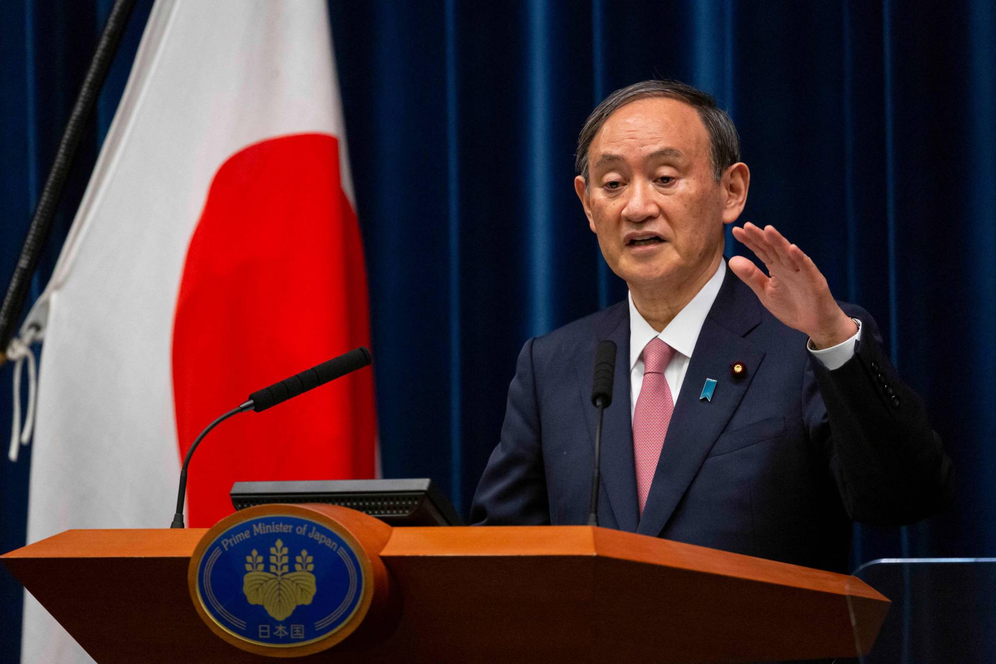 Prime Minister Yoshihide Suga speaks during a news conference in Tokyo on May 14. | Pool / via AFP-Jiji