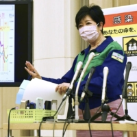 Tokyo Gov. Yuriko Koike speaks at a news conference in Tokyo on Friday. | KYODO