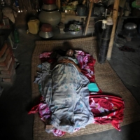 A woman with COVID-19 receives oxygen support inside her house in the village of Debipur in India\'s West Bengal state.  | REUTERS