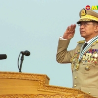 Myanmar Gen. Min Aung Hlaing salutes during an annual parade put on by the military to mark Armed Forces Day in the capital Naypyidaw on March 27.  | MYAWADDY TV / VIA AFP-JIJI