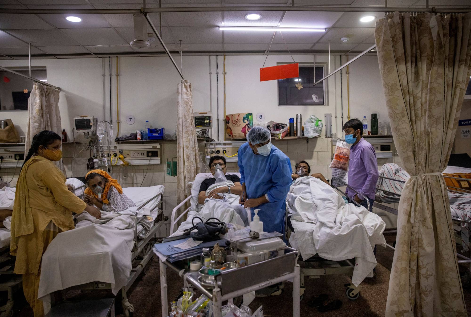 A doctor treats patients with COVID-19 at Holy Family Hospital in New Delhi on May 1. | REUTERS 