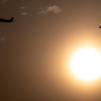 An aircraft approaches Haneda Airport on May 10. |  AFP-JIJI
