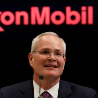 Darren Woods, chairman and CEO of Exxon Mobil Corporation, speaks during a news conference at the New York Stock Exchange in 2017. | REUTERS 