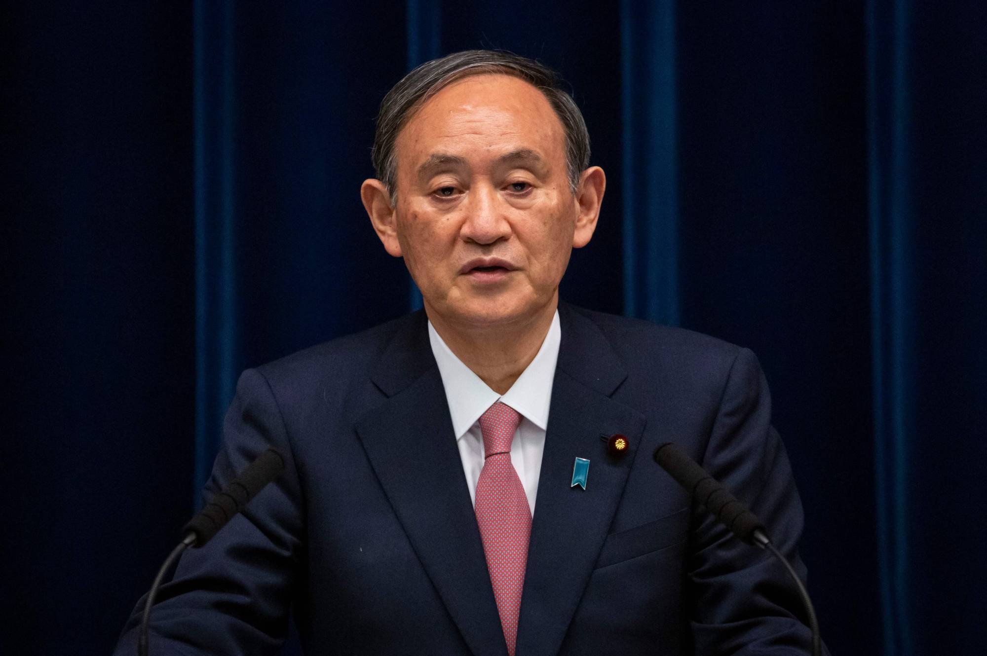 Prime Minister Yoshihide Suga speaks during a news conference in Tokyo on May 14. | POOL / via AFP-Jiji
