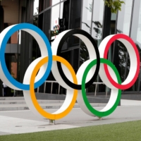 Japan may require negative COVID-19 test results or vaccination records from fans attending the Tokyo Olympics, according to a report. | REUTERS