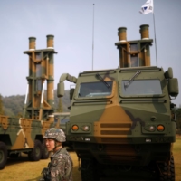 A South Korean soldier walks past Hyunmoo-2 (left) and Hyunmoo-3 ballistic missiles ahead of a celebration to mark the 69th anniversary of Korea Armed Forces Day, in Pyeongtaek, South Korea, in September 2017.  | REUTERS