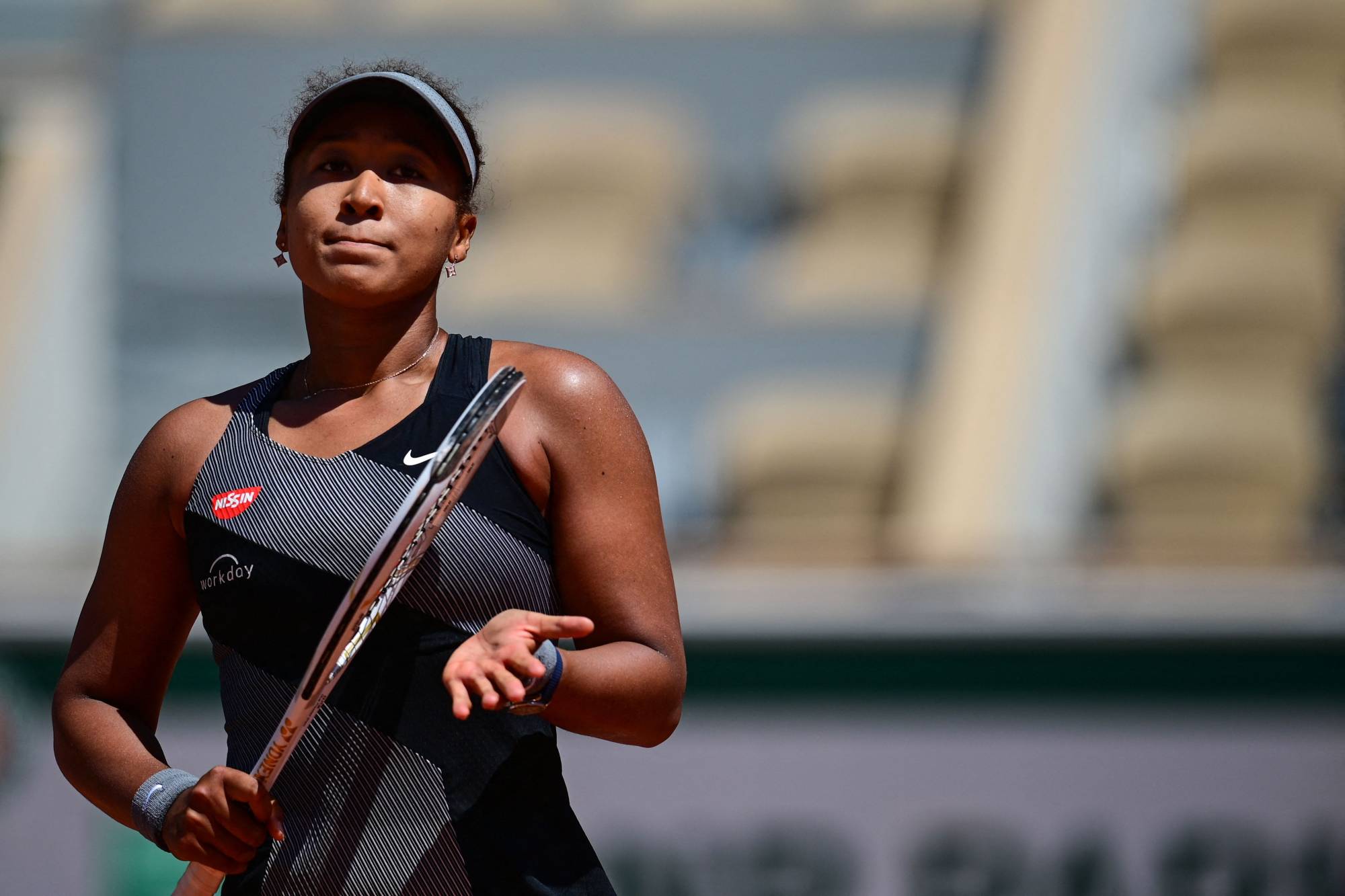 Naomi Osaka celebrates after winning against Romania's Patricia Maria Tig on Day 1 of the French Open in Paris. | AFP-JIJI