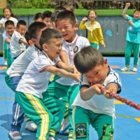 Children play at a kindergarten in Yantai, in China\'s eastern Shandong province, on Monday. | AFP-JIJI