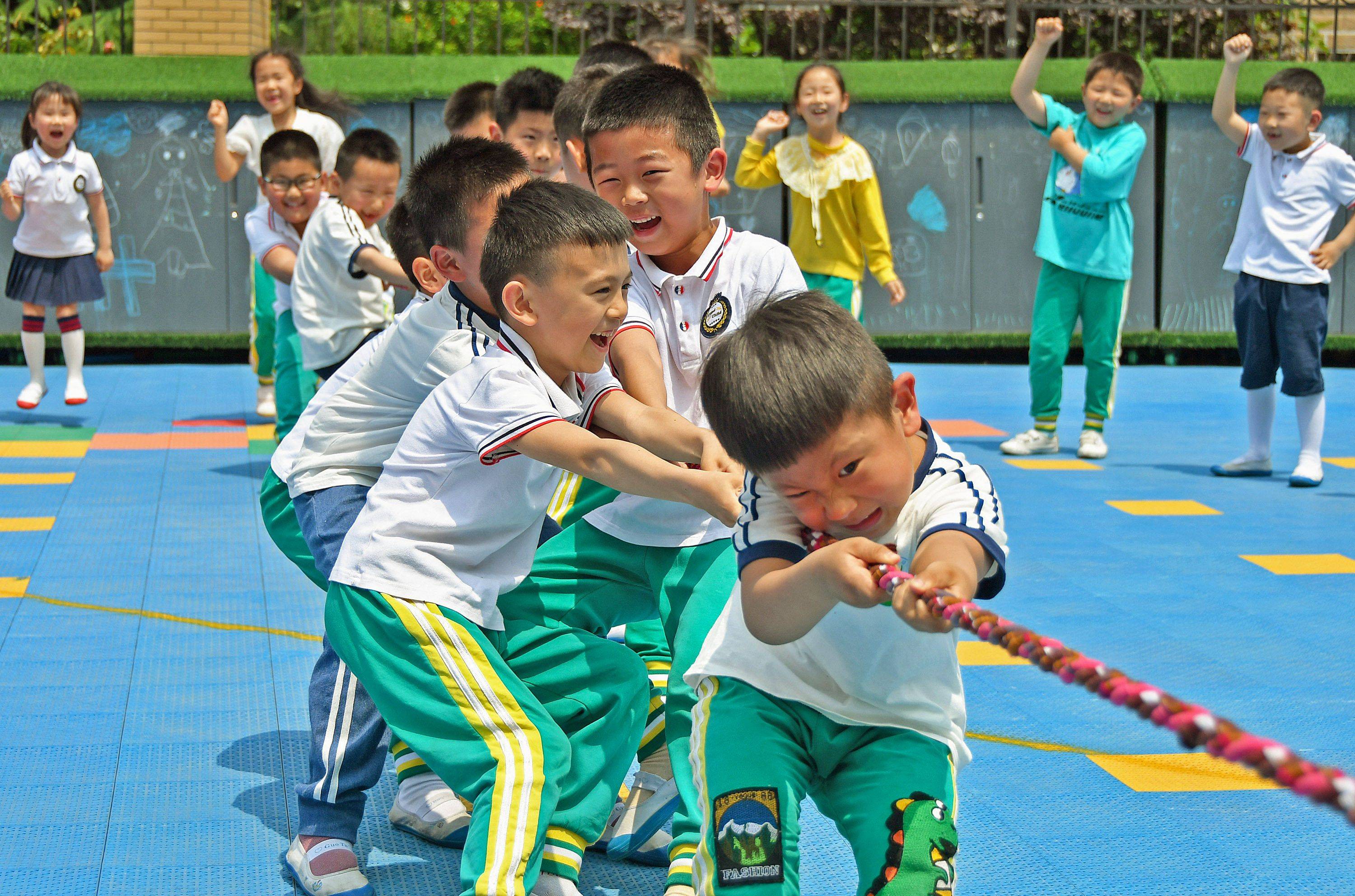 Children play at a kindergarten in Yantai, in China's eastern Shandong province, on Monday. | AFP-Jiji