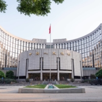 The People\'s Bank of China headquarters in Beijing. The heavily managed yuan is at three-year highs, having rallied through major resistance at 6.4 per dollar, and it clocked its best month since November in May. | BLOOMBERG