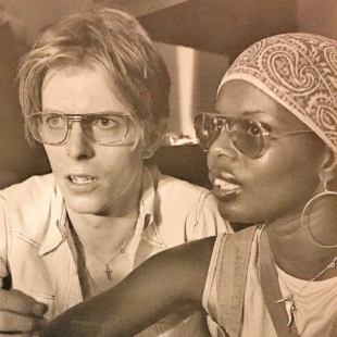 Ash Hudson's mother, Ola (right), worked with many music icons including David Bowie, pictured with her here. | 
