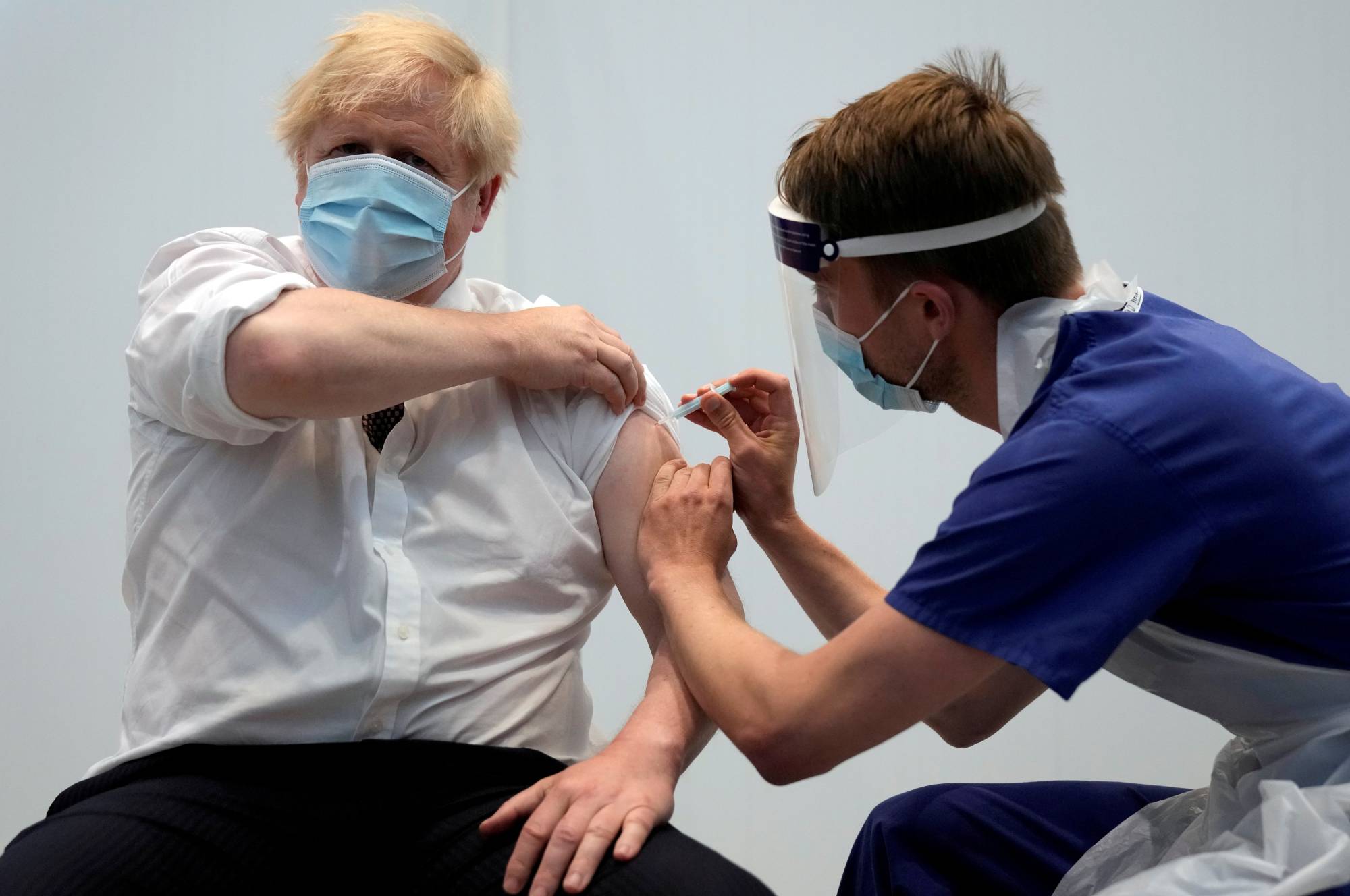 British Prime Minister Boris Johnson receives his second dose of the AstraZeneca COVID-19 vaccine at the Francis Crick Institute in London on Thursday. | REUTERS