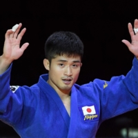 Joshiro Maruyama celebrates after winning the men\'s 66-kg final against Italy\'s Manuel Lombardo during the 2021 Judo World Championships on Monday in Budapest. | AFP-JIJI