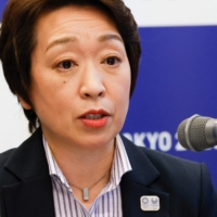 Tokyo 2020 President Seiko Hashimoto said Tuesday that visiting journalists covering the Tokyo Olympics will be closely monitored via GPS. | POOL / VIA AFP-JIJI