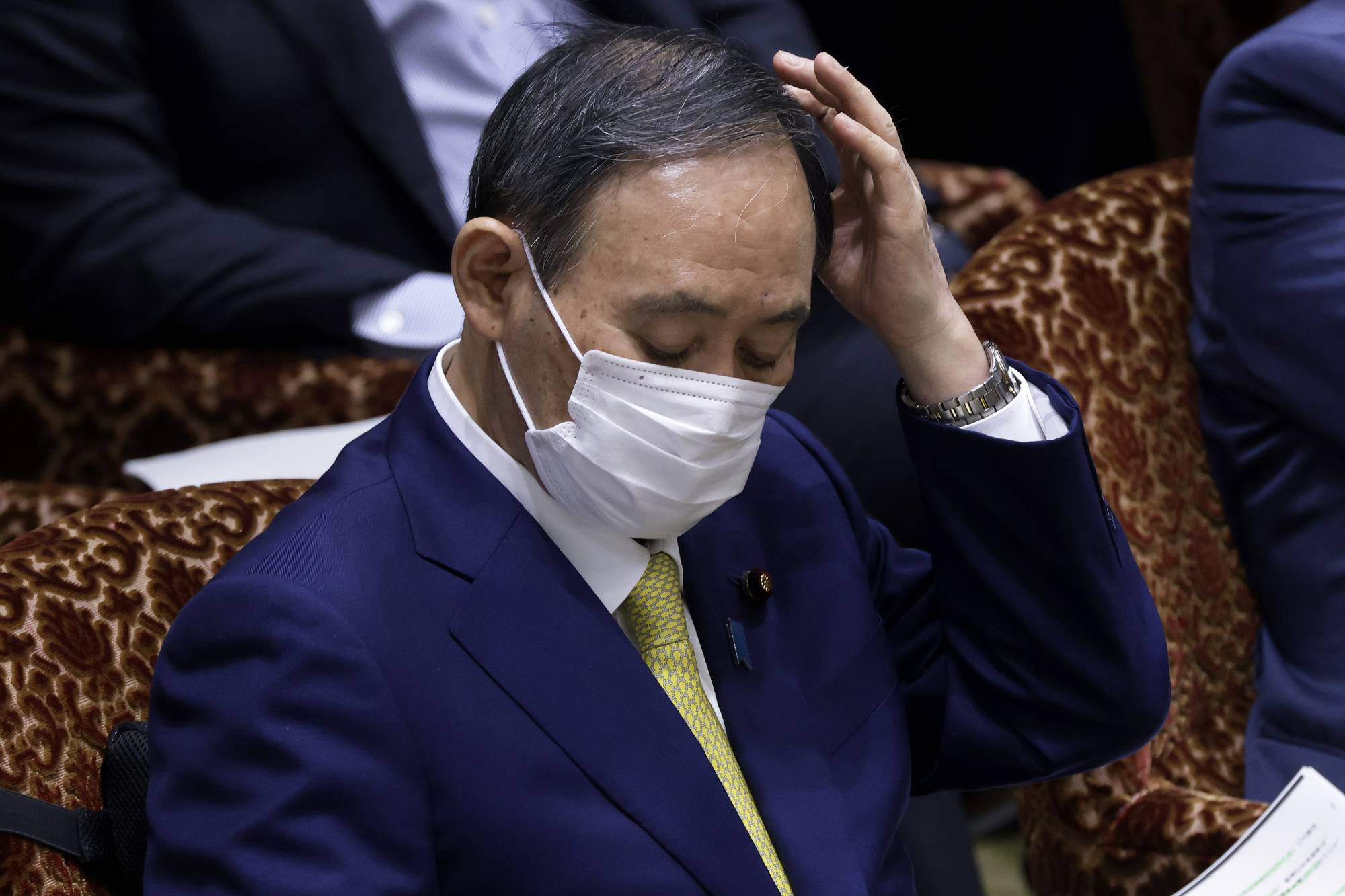 Prime Minister Yoshihide Suga attends an audit committee session at the upper house of parliament in Tokyo on Monday. | BLOOMBERG