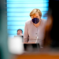 German Chancellor Angela Merkel arrives for a Cabinet meeting in Berlin on Wednesday.  | POOL / VIA AFP-JIJI