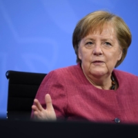 German Chancellor Angela Merkel addresses the media in Berlin on June 2.  | POOL / VIA AFP-JIJI