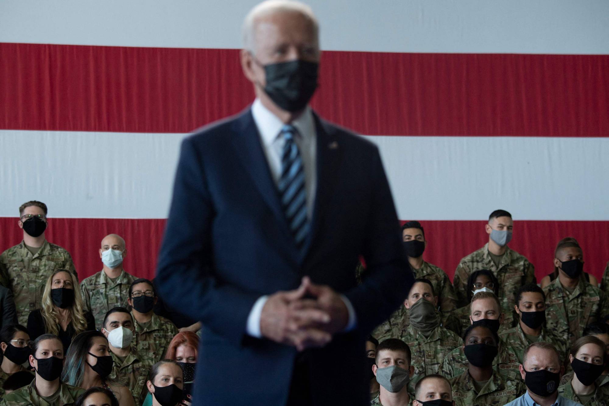 U.S. President Joe Biden prepares to address U.S. Air Force personnel and their families stationed at Royal Air Force Mildenhall in England on Wednesday. | AFP-JIJI