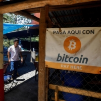 Bitcoin banners outside of a small restaurant at El Zonte Beach in Chiltiupan, El Salvador, on June 8 | REUTERS 