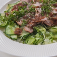Tender slices of make-ahead pork and a flavorful ume dressing are the perfect toppings for a light summer salad. | MAKIKO ITOH
