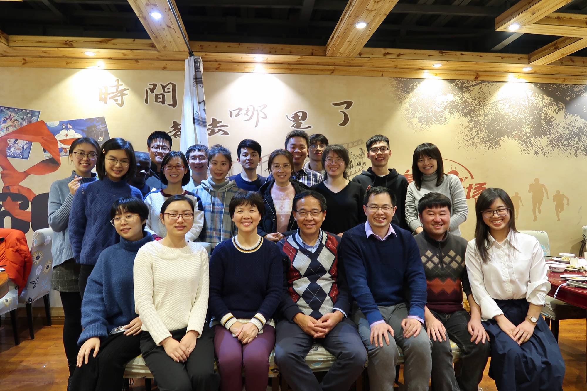 Dr. Shi Zhengli (third from left in the front row), sits with her fellow virologist Wang Linfa (fourth from left) and colleagues from the Wuhan Institute of Virology at a restaurant in Wuhan, China, on Jan. 15, 2020. Zhengli said in a rare interview that speculation about her lab in Wuhan was baseless, but China’s habitual secrecy makes her claims hard to validate. | Courtesy of Wang Linfa / via The New York Times