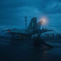 An F/A-18F Super Hornet fighter jet launches from the flight deck of the USS Ronald Reagan aircraft carrier in the South China Sea on Monday. | U.S. NAVY