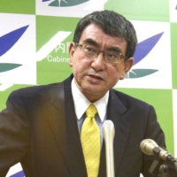 Taro Kono, minister in charge of the COVID-19 vaccine rollout, speaks at a news conference in Tokyo on Tuesday. | KYODO
