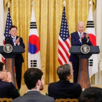 Sung Kim stands after U.S. President Joe Biden announced Kim would serve as a special U.S. envoy for North Korea, during a joint news conference with South Korea\'s President Moon Jae-in at the White House, in Washington, on May 21. | REUTERS