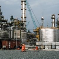 An oil refinery outside Lagos. The economy has yet to recover from the oil crash of 2014, and is unlikely to do so anytime soon, meaning its population will continue to outpace economic expansion — adding more poor to what is already the poverty capital of the world. | BLOOMBERG