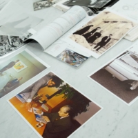 Japanese architect Paul Noritaka Tange, who designed the Tokyo Aquatics Center for the Tokyo 2020 Olympic Games, shows his family photos of his father, Kenzo Tange, in Tokyo on May 17.  | REUTERS