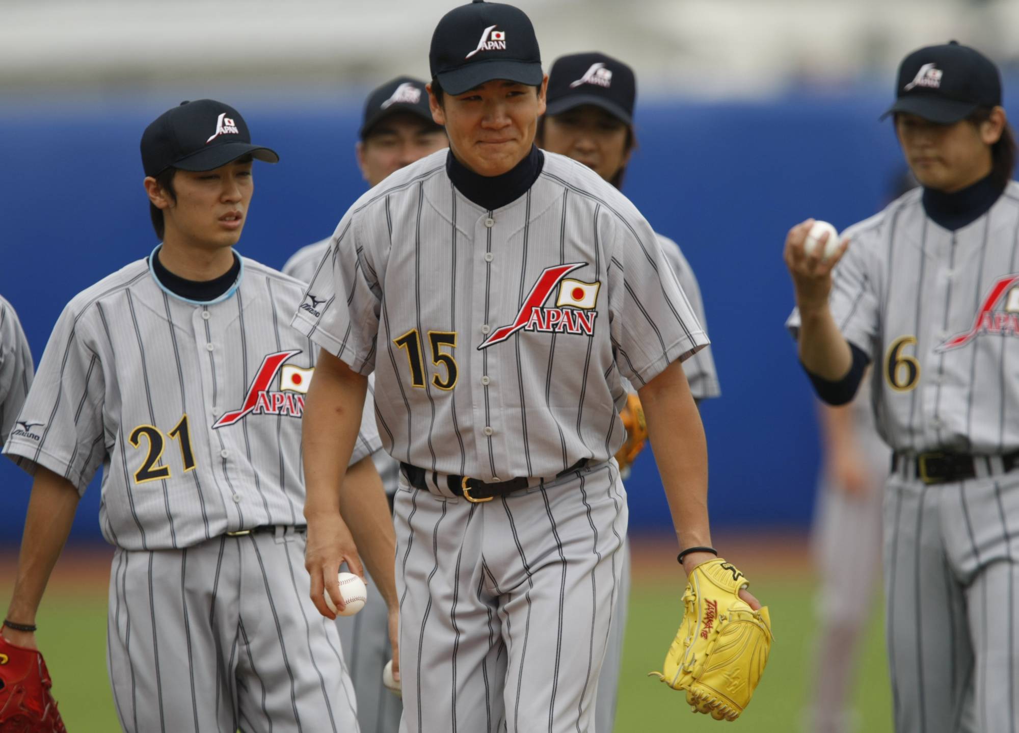 Masahiro Tanaka (center) practices with his teammates at Wukesong Sports Center Baseball Field in Beijing during the 2008 Olympics. | REUTERS