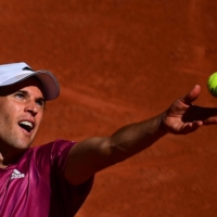 Dominic Thiem serves to Pablo Andujar during the first round of the French Open on in Paris on May 30.  | AFP-JIJI