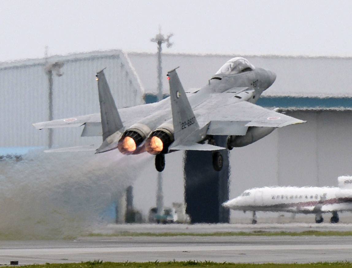 An F-15 fighter jet takes off from an Air Self-Defense Force base in Naha in April 2015. | KYODO