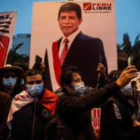 Supporters of Peru\'s left-wing presidential candidate for the Peru Libre party, Pedro Castillo, march in Lima on Saturday. | AFP-JIJI