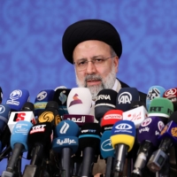 Iranian President-elect Ebrahim Raisi speaks during a news conference in Tehran on Monday.  | WEST ASIA NEWS AGENCY / VIA REUTERS 