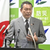 Hachiro Okonogi, chairman of the National Public Safety Commission, speaks at a news conference in Tokyo on Tuesday. | KYODO