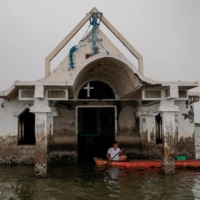 A partly submerged church in the coastal village Sitio Pariahan, Bulakan, Bulacan, north of Manila, Philippines, in 2019 | REUTERS 