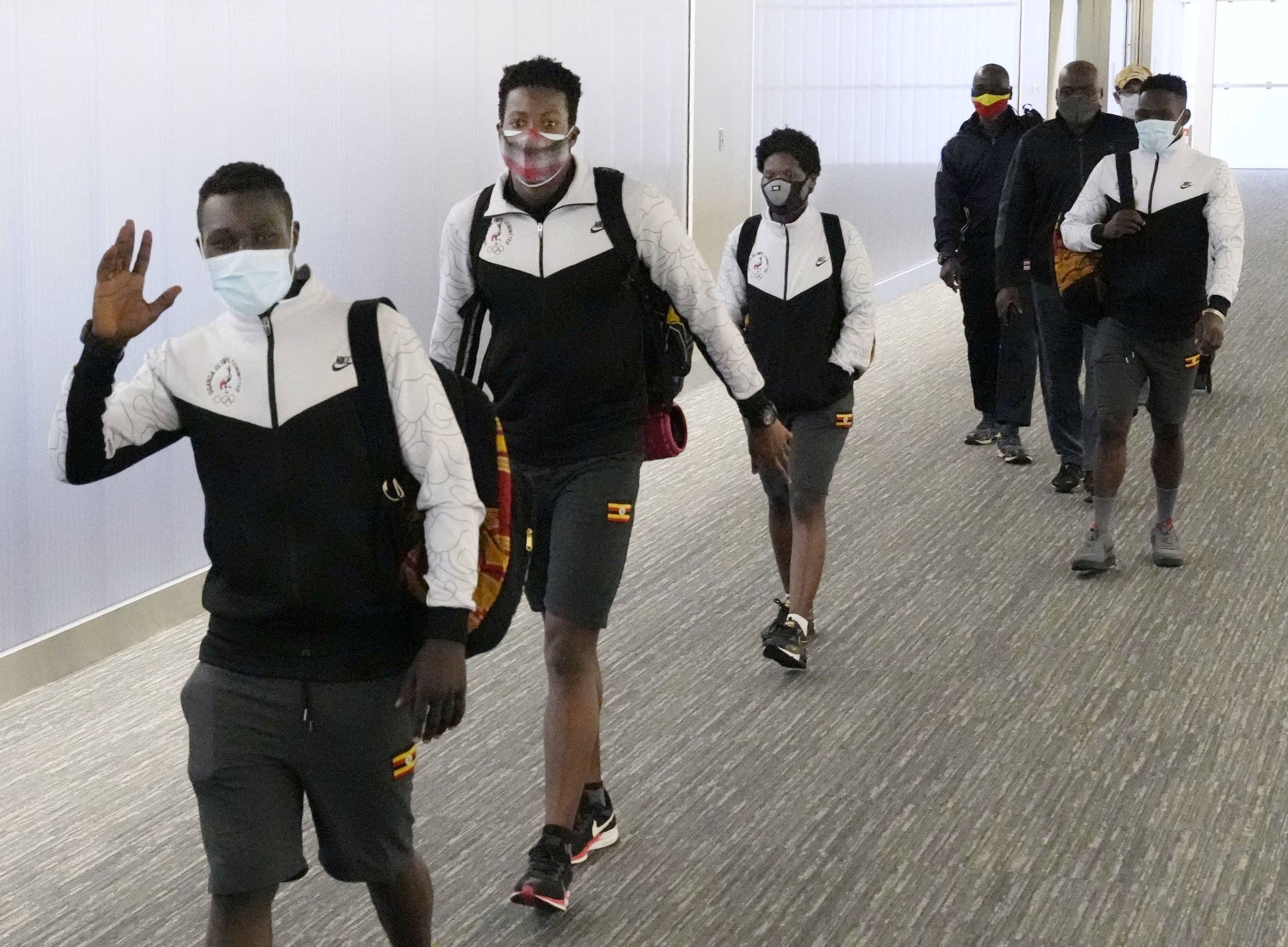 Members of Uganda's Olympic team arrive at Narita Airport on Sunday.  | KYODO 