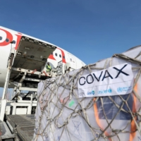 Ethiopian Airlines staff unload AstraZeneca vaccines under the COVAX program at Bole International Airport in Addis Ababa, Ethiopia, in March. | REUTERS 