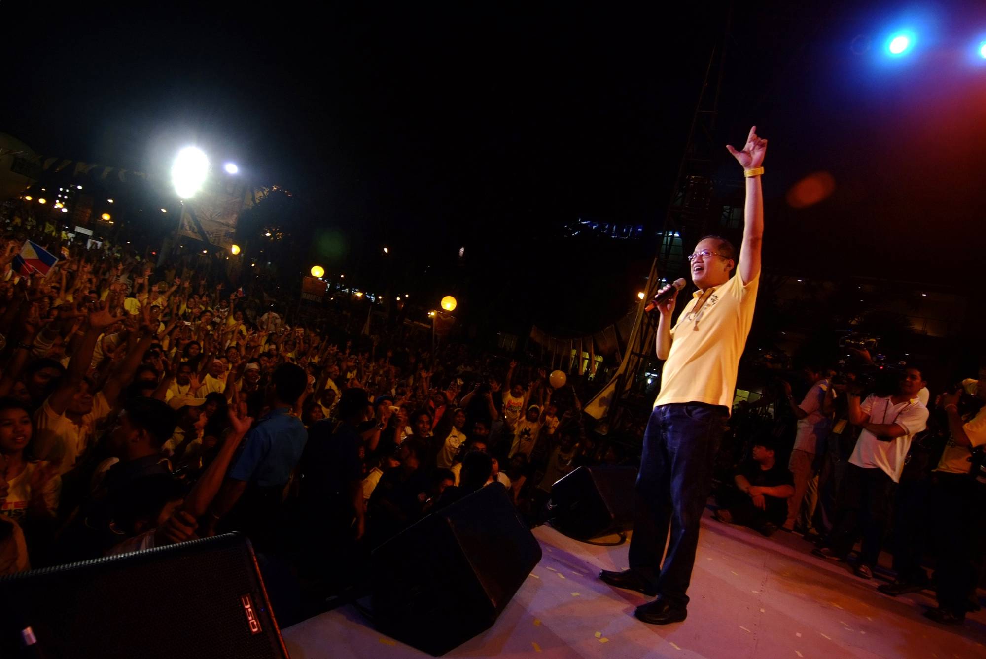 Benigno Aquino III waves to supporters during a campaign stop in Quezon City, Philippines in February 2010. | Jes Aznar / The New York Times