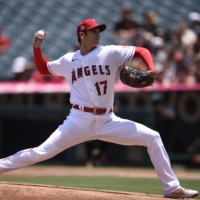 Angels pitcher Shohei Ohtani delivers against the Giants during the first inning on Wednesday in Anaheim, California. | USA TODAY / VIA REUTERS