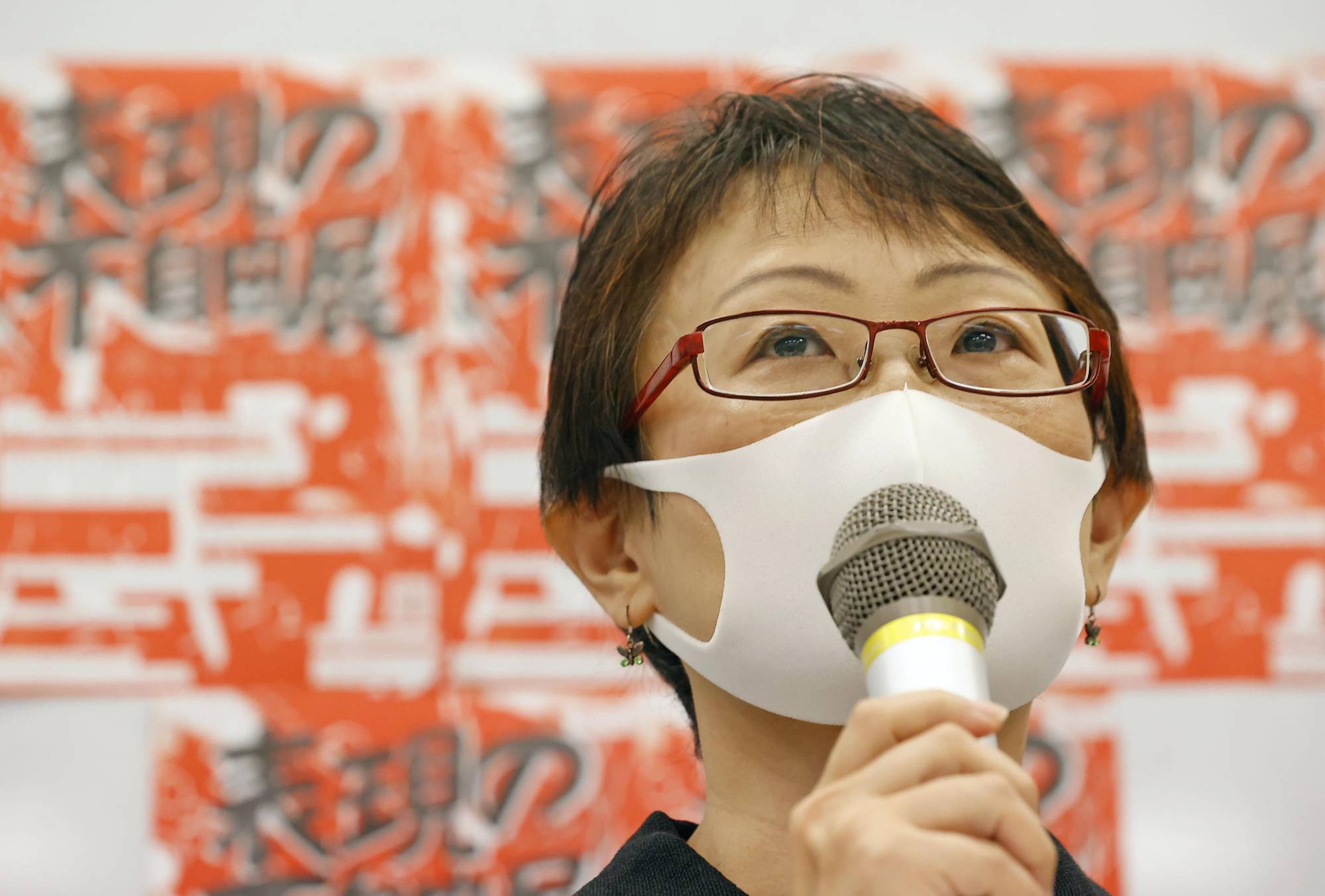 Yuka Okamoto, an organizer of an art exhibition in Tokyo titled 'Non-Freedom of Expression Exhibition,' speaks at a news conference Wednesday. | KYODO