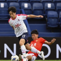 Cerezo\'s Tatsuhiro Sakamoto controls the ball during his team\'s Asian Champions league match against Guangzhou FC in Buriram, Thailand, on Thursday. | CEREZO OSAKA / VIA KYODO
