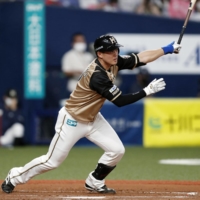 The Fighters\' Yuto Takahama connects on an RBI single against the Buffaloes in Osaka on Thursday. | KYODO