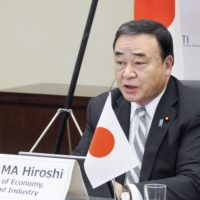 Economy minister Hiroshi Kajiyama attends a meeting with ASEAN ministers on Monday.  | METI / VIA KYODO 