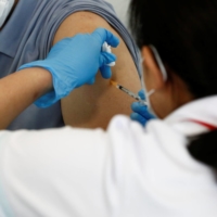 Tokyo Olympic and Paralympic Games organizers will give all 70,000 volunteers working for the games an opportunity to receive a COVID-19 vaccine | POOL / VIA REUTERS