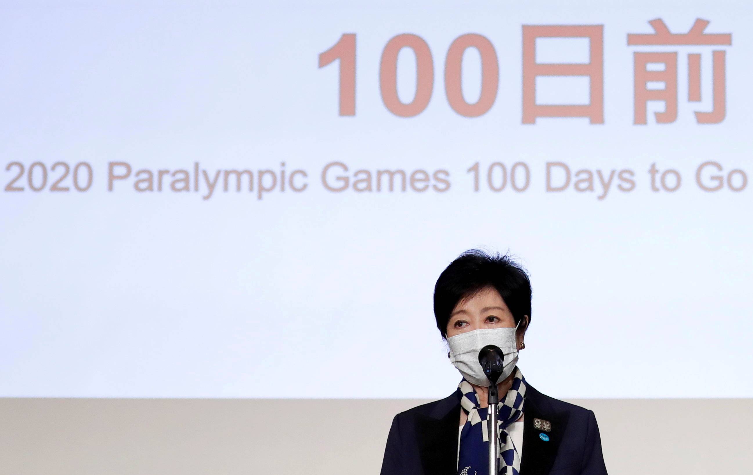 Tokyo Gov. Yuriko Koike delivers a speech during a ceremony to mark 100 days until the opening of the Tokyo 2020 Paralympic Games in the capital on May 16. | POOL / VIA REUTERS