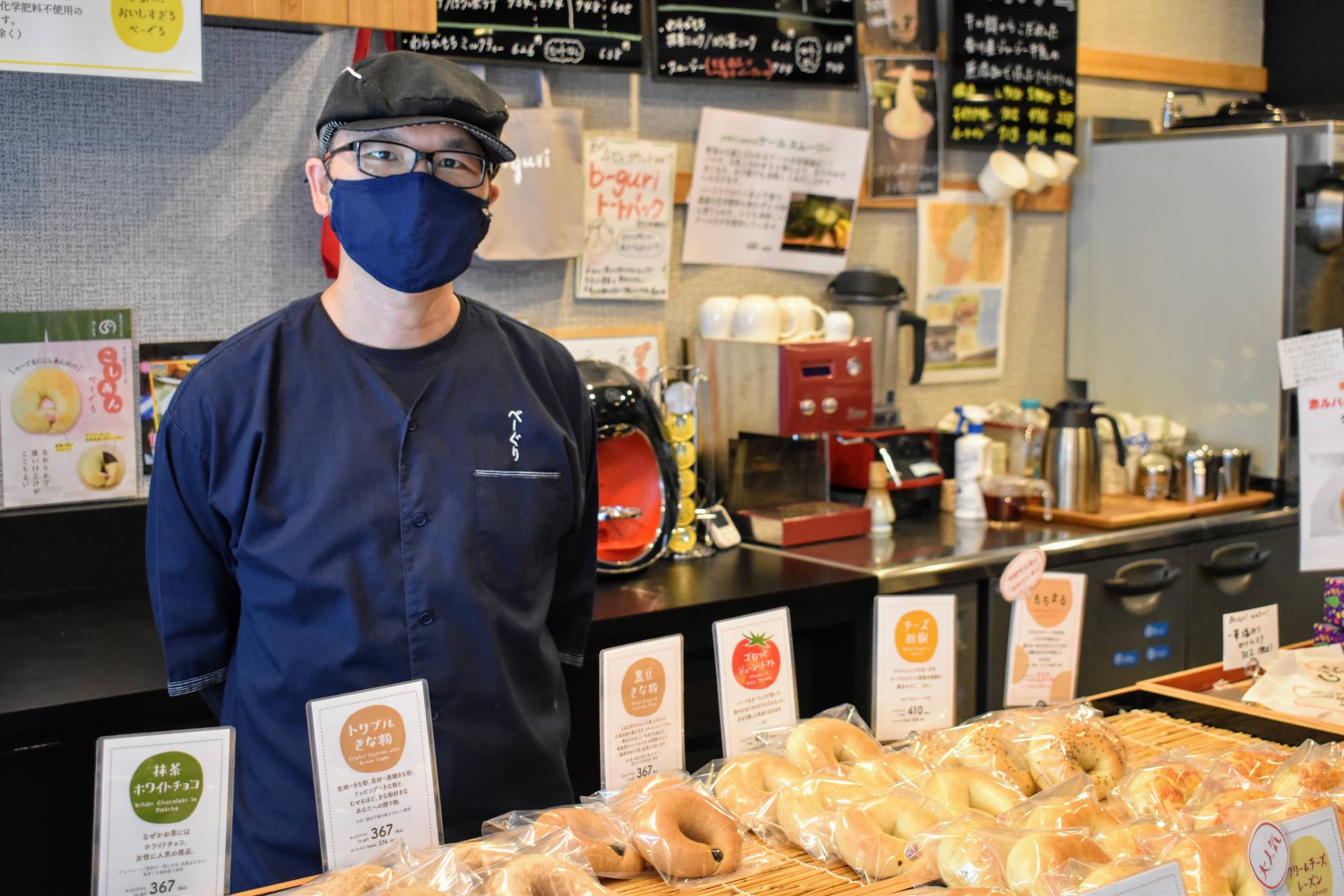 Yutaro Ueguri, who runs an organic bagel shop in Tokyo's Edogawa Ward, is adamant that he and his family won't get vaccinated against COVID-19, saying he doesn't want to absorb anything artificial into his body. | TOMOHIRO OSAKI
